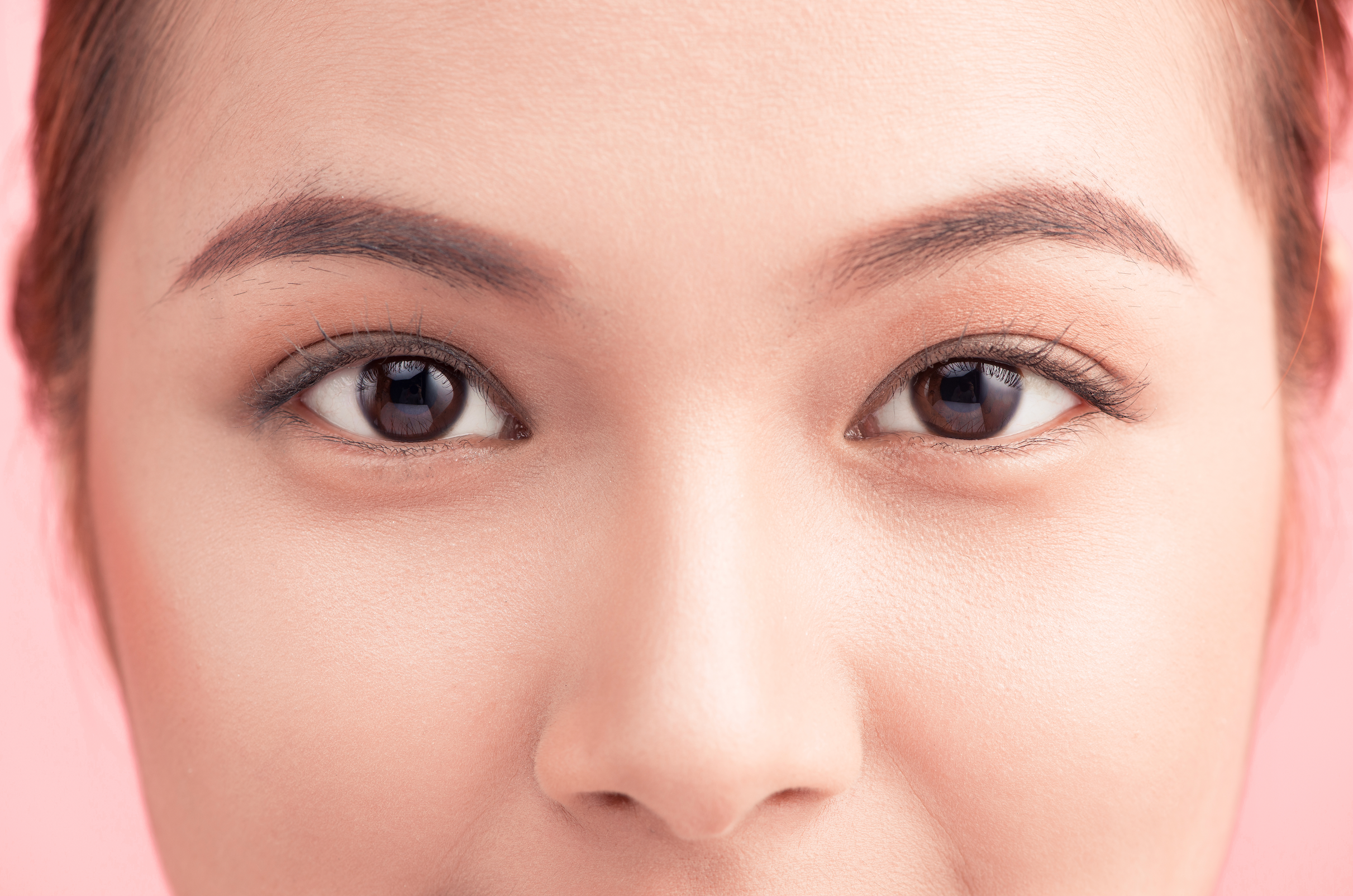 Close-up of a beautiful woman's face highlighting her expressive eyes and natural complexion